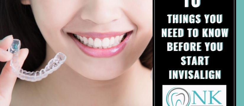 Lady smiling holding invisalign strip