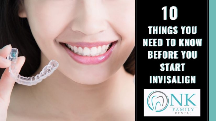 Lady smiling holding invisalign strip