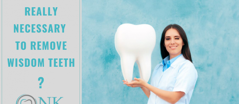 Dentist holding a large wisdom tooth