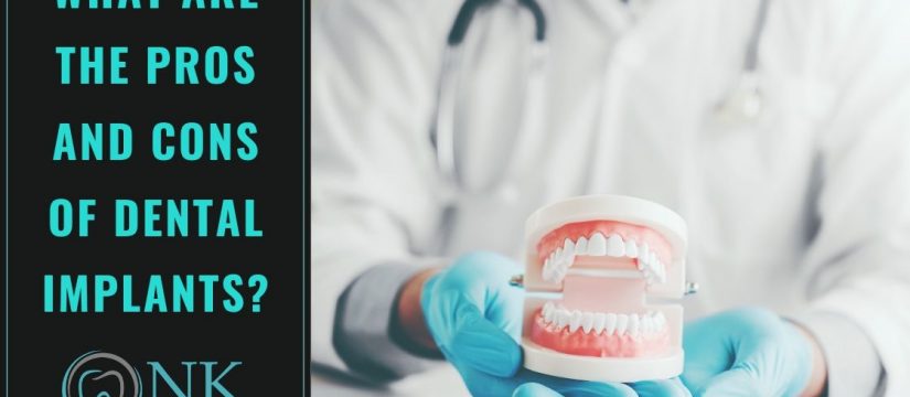 dentist with dental implant